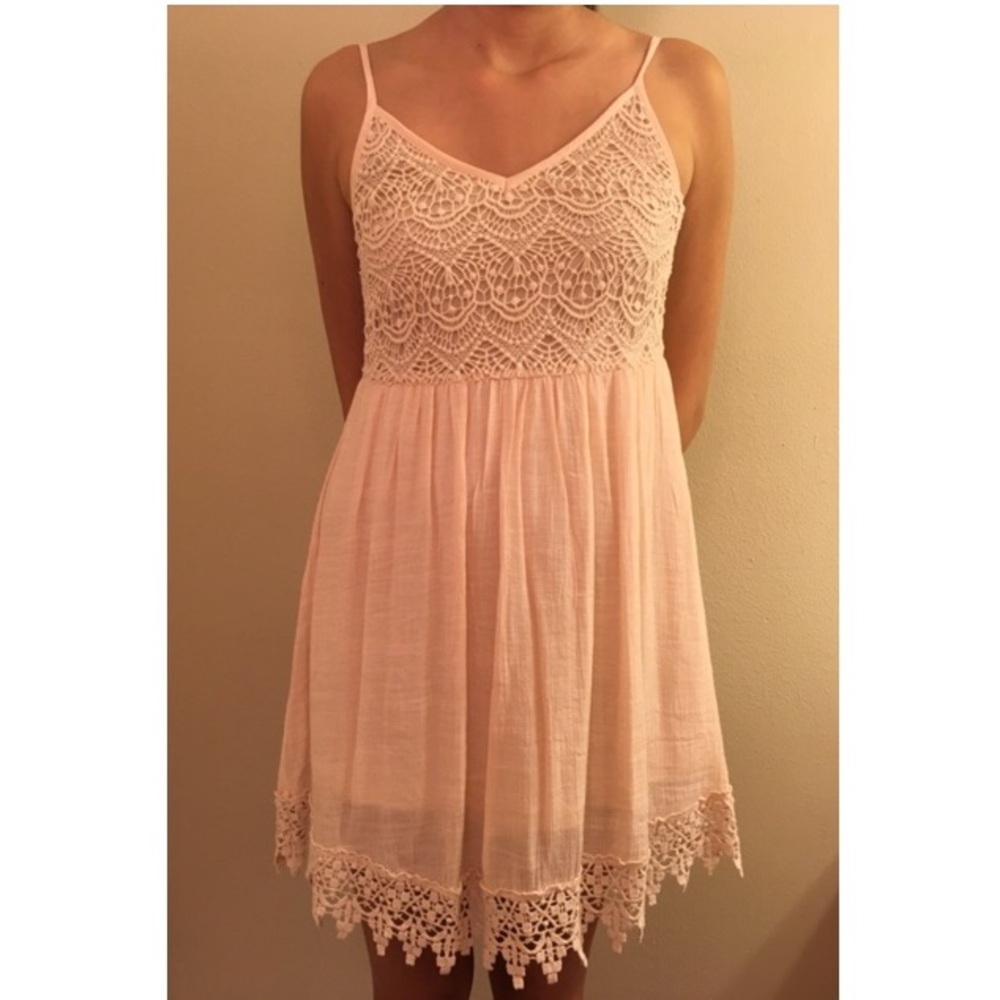 Cream colored lacy dress.